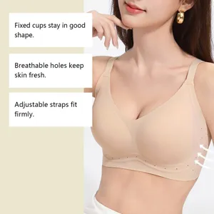 Detail shot showing breathable holes, fixed cups, and adjustable straps of a seamless bra.