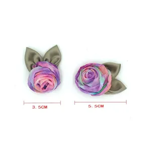 Close-up details of mesh rose flower fabric accessories with leaves, perfect for DIY crafts and hair.