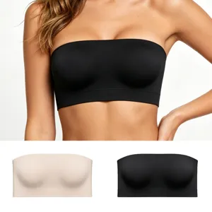 Detail view of the strapless bandeau bra in black and beige, featuring seamless fabric.