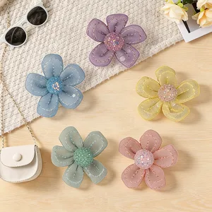 Detail view of colorful handmade mesh sequin five-petal flower accessories, perfect for DIY.