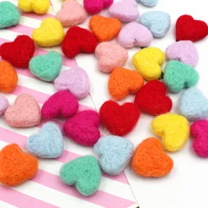 Colorful wool felt heart shaped DIY accessories, perfect for handmade crafts and clothing.