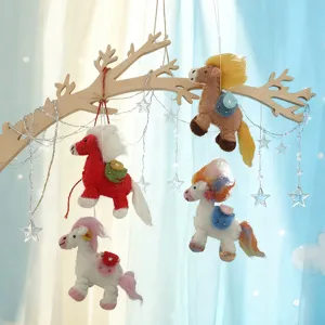 Handmade wool felt horse hanging ornament set with wooden branch, perfect for nursery decor.