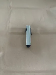Detail shot of chrome bidet sprayer nozzle with press switch and threaded connector.