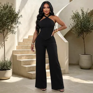 Detail shot of black halter neck top and wide leg pants set, elegant commuting style.