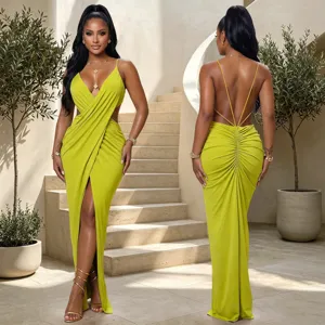 Detail view of the elegant lime green evening dress with cutout waist and split hem.