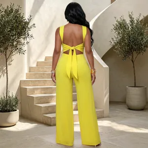 Chic yellow backless twist waist wide leg jumpsuit, elegant commuter outfit for women.