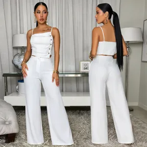 Elegant white two-piece set featuring a sleeveless camisole top and wide-leg trousers.