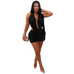 Close-up detail shot of the sexy halter plunging V-neck bodycon mini dress showing fit.