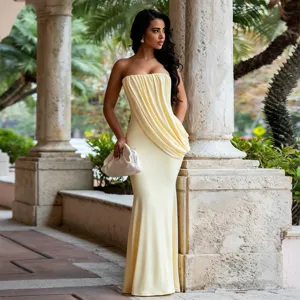 Stunning strapless draped mermaid evening gown detail featuring elegant yellow fabric and fitted silhouette.