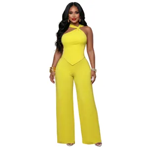 Stylish yellow two-piece outfit with twist top and wide-leg trousers for chic daily commuting wear.