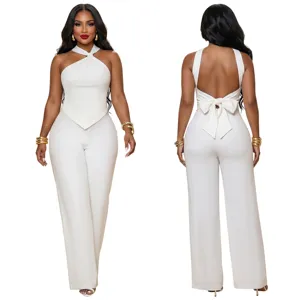 Elegant white halter neck sleeveless crop top with back bow and matching wide leg pants set.