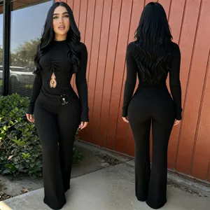Women's black ribbed long sleeve cutout high waist flared casual jumpsuit detail view.