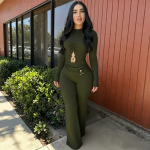 Detailed view of the olive green ribbed long-sleeve cutout jumpsuit with metal rings.