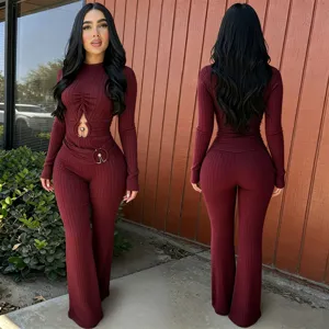 Ribbed cutout long sleeve high waist bell bottom jumpsuit detail showcasing wine red knitwear.