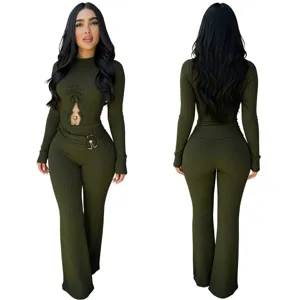 Olive green ribbed long sleeve jumpsuit featuring chic cutout details and metal ring accents.