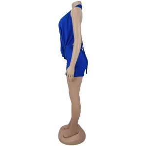 Detailed side view of blue halter neck romper showcasing waist design and shorts fit.