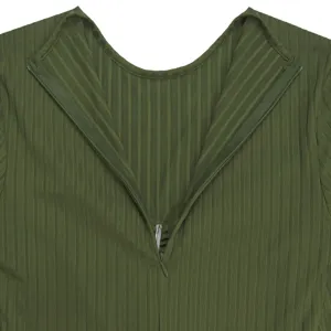 Detail shot of dark green ribbed jumpsuit back collar and invisible zipper design.