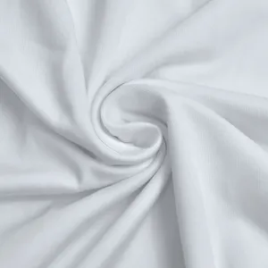 White fabric detail texture shot showcasing soft draped material close-up for women dress design.