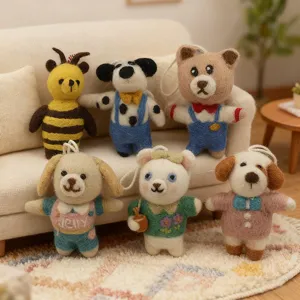 Detailed view of handmade wool felt animal plush pendants, cute miniature keychain charms.