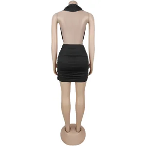 Detail view of a black backless halter neck ruched mini dress, showcasing stylish club wear.