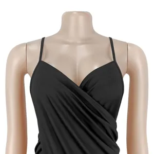 Close-up detail of black thin strap V-neck cross dress, showing the elegant pleated texture.