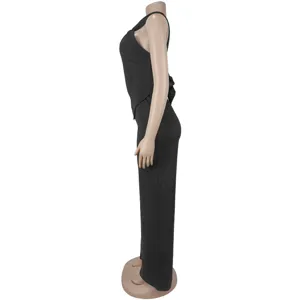 Side detail view showing the black sleeveless top and wide leg pants outfit design.