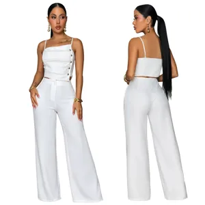 White two-piece set featuring an asymmetrical button camisole and matching wide-leg pants.