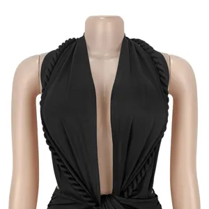 Close-up detail of the sexy black deep v-neck halter mini dress with twisted rope straps.
