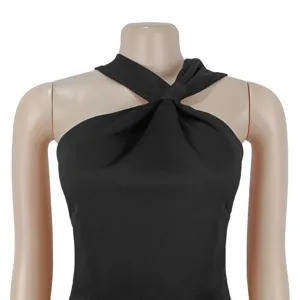 Detailed view of women elegant black halter top with front twist design for stylish look.