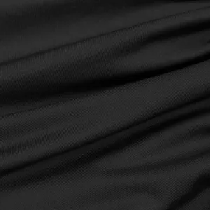 Detailed view of the black ribbed fabric texture for women's dress, soft and elastic.