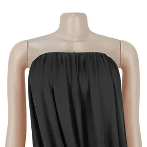 Detail view of a sleek black strapless drape long dress, elegant party evening gown fashion.