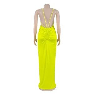 Back view detail of the neon yellow strappy evening dress featuring a stunning crisscross design.