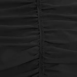 Close-up detail of black dress fabric featuring gathered ruching and center drawstring.