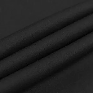 Black fabric detail close up texture view showing fine quality material and soft touch.