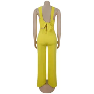 Detail view of the yellow sleeveless top showing back bow and wide-leg trousers design.