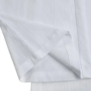 White pleated fabric texture clothing detail close up view for women fashion apparel