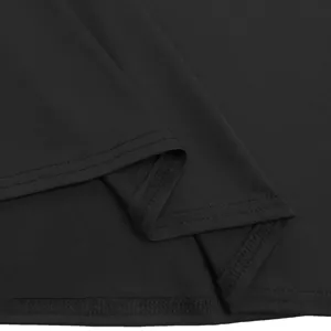 Close-up fabric and hem detail of the black women's dress, showing fine stitching work.