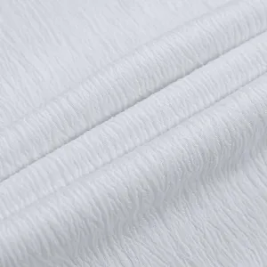 White solid color textured pleated fabric detail view, soft and elegant material style.