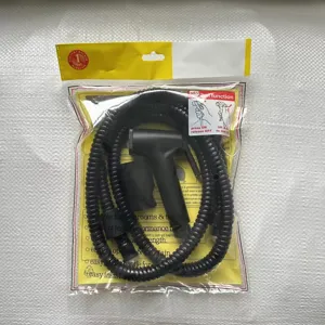 Plastic bidet sprayer set with flexible hose and bracket for bathroom toilet cleaning.