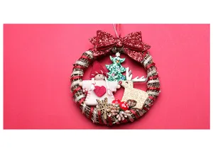 Details of the Christmas wreath with glitter bow, cute plush doll, and festive tree decorations.