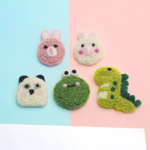 Cute wool felt cartoon animal patches featuring dinosaur, rabbit, frog, and panda designs.