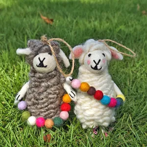 Handmade wool felt sheep hanging ornament detail view, cute multi-color felt balls decoration.