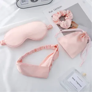 Faux silk sleep eye mask headband scrunchie and dust bag 4 piece set in elegant pink color.