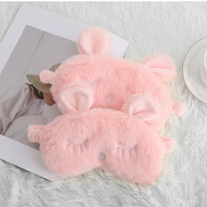 Cute pink plush bunny ear sleeping mask detail, soft fuzzy eye mask with sweet embroidery.