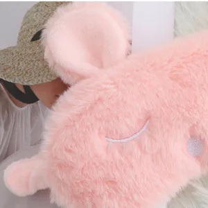 Cute pink plush bunny ear sleep mask detail shot, soft and comfortable shading eye cover.