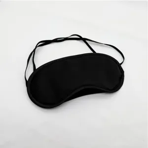 Masque de sommeil occultant noir avec tissu respirant et sangle élastique pour le repos.