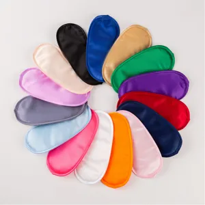 Close-up shot showing colorful satin sleep masks arranged in a circular pattern for details.