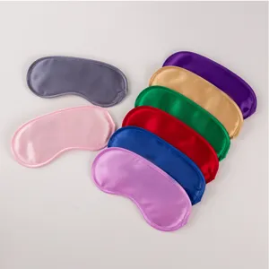 Detailed view of multiple colored satin sleep masks, breathable and soft for travel rest.