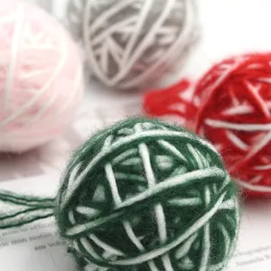 Handmade 5cm Christmas yarn ball hanging ornament, dual-color string wrapped decor for home.