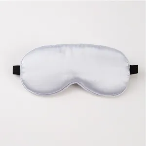 Plain light grey silk sleep mask with black elastic strap, smooth texture for comfortable night rest.